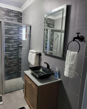 Shower, hair dryer - TORRE ALTA 1 Bedroom Apt 5B (Puerto Plata)