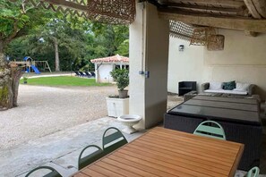 Outdoor dining - Charming French Countryside Escape with Pool (Barry d'Islemade)