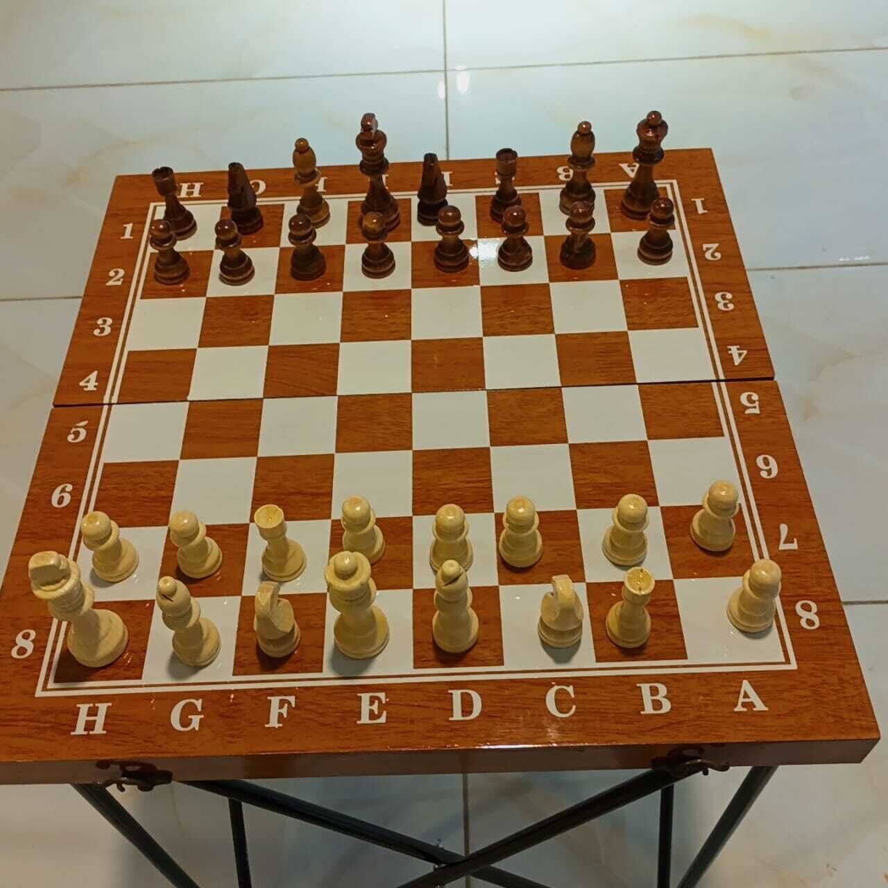 A chessboard with pieces set up for a game.