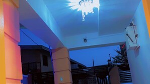 An entrance with a bright light fixture, a gated area, and a tiled floor. - Make Yourself at Home with Luxury Living and Unmatched Comfort (Osogbo)