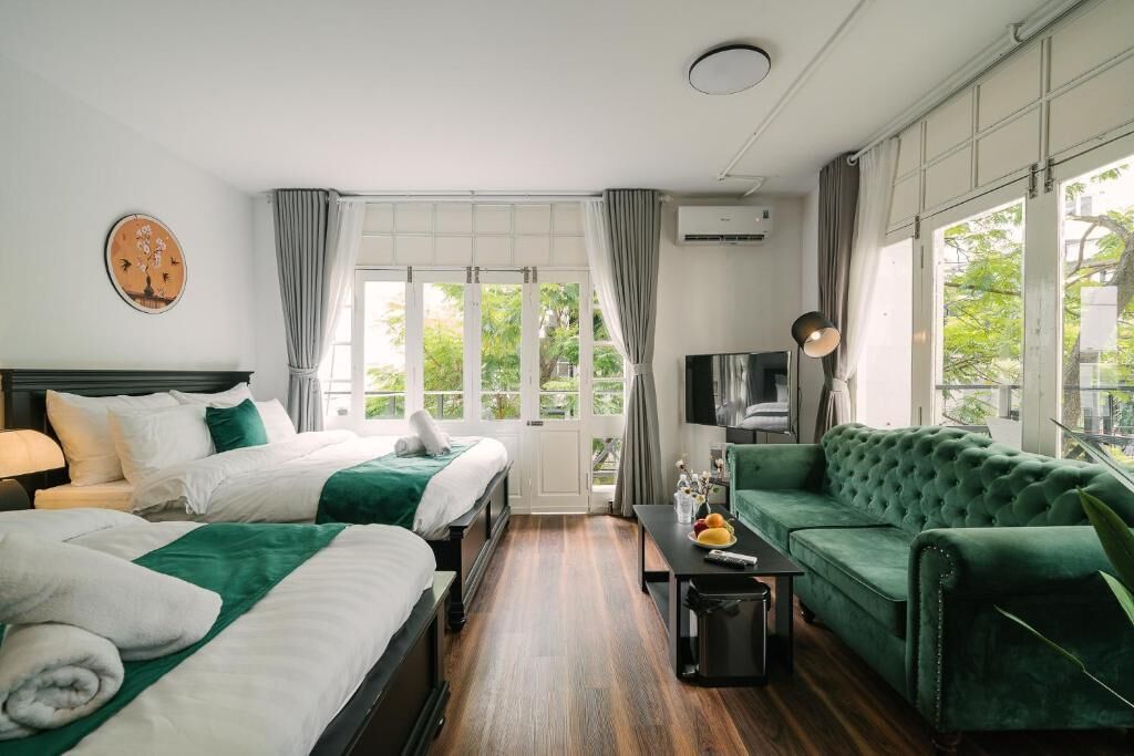 Deluxe Quadruple Room, Balcony, City View | Desk, laptop workspace, soundproofing, iron/ironing board