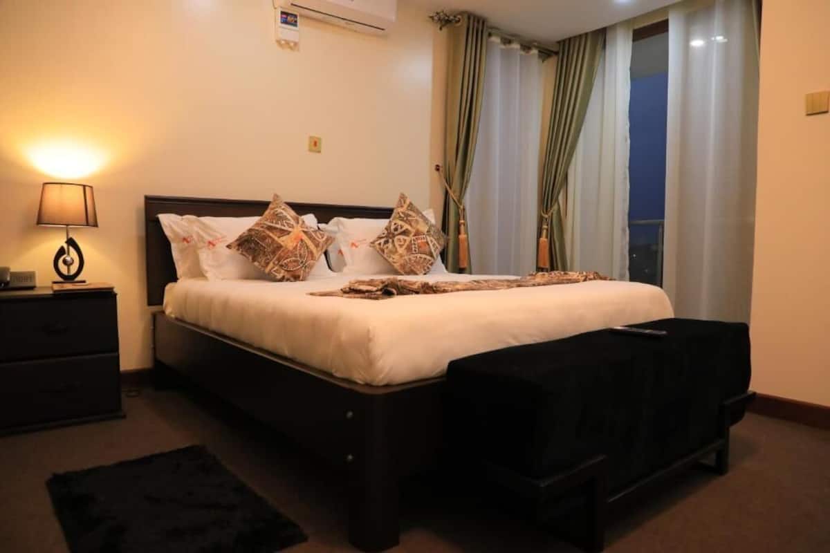 Deluxe Double Room, Balcony, City View | In-room safe, blackout drapes, soundproofing, iron/ironing board