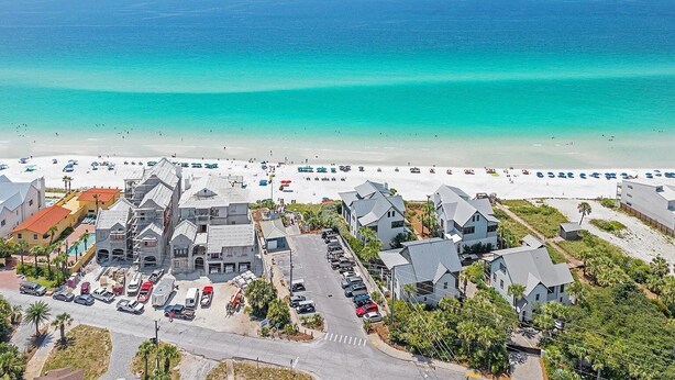 A coastal town with a beach, residential buildings, and a parking area. - Rolling Retreat 77–Gulfview Escape–Sleeps 16 (Santa Rosa Beach)