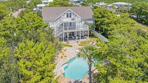 A two-story house with a large balcony and a swimming pool. - Rolling Retreat 77–Gulfview Escape–Sleeps 16 (Santa Rosa Beach)