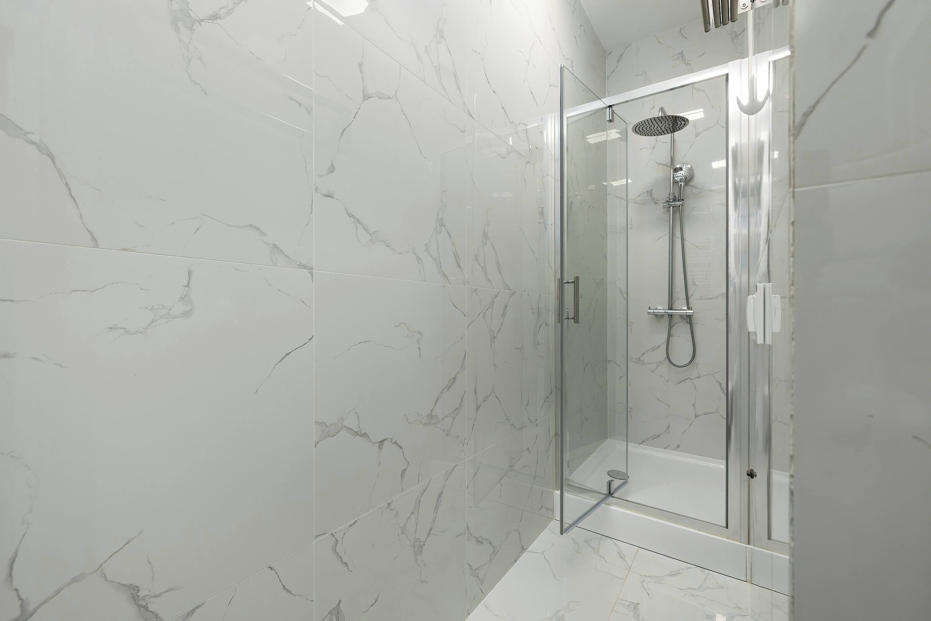 Shower, hair dryer, towels, shampoo