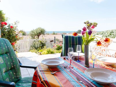 Charming Cottage with Parking, Two Terraces, and Modern Amenities - Pet Friendly