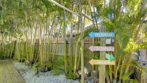 A wooden signpost with directional arrows labeled 'Mermaid,' 'Octopus,' and 'Anchor.' - Walk to Everything! Johns Pass Gem w/ Dock Access (Madeira Beach)