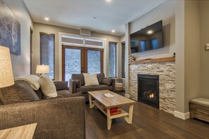 TV, fireplace - Bottom Floor, Walk Out Condo with great ski access and private hot tub! (Sun Peaks)