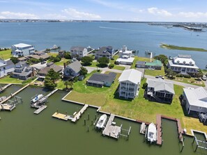 An aerial view of a residential area with houses, docks, and a marina. - Bayview Anchor-Pet Friendly Home with Dock (Atlantic Beach)