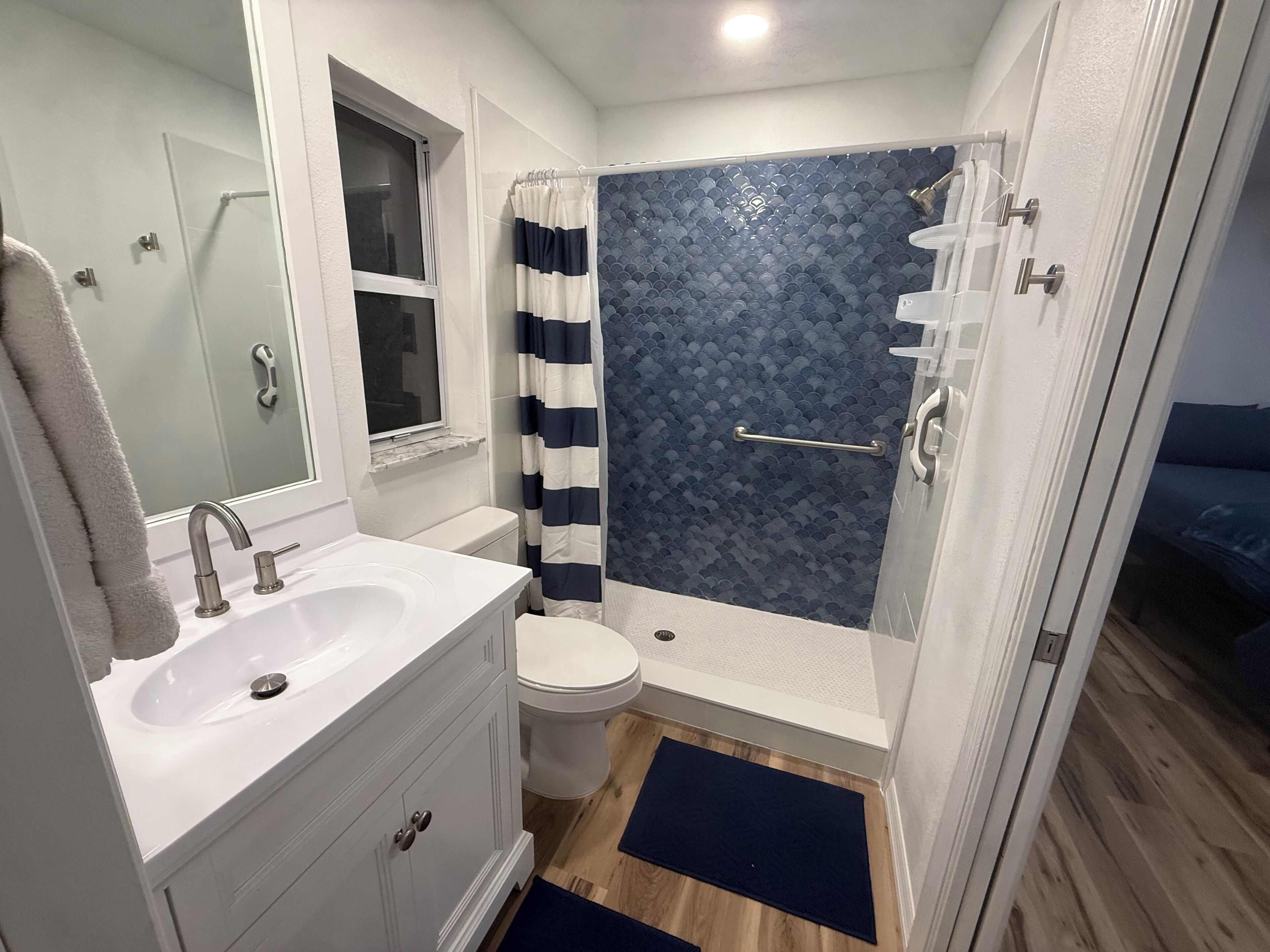 Shower, hair dryer, towels, toilet paper