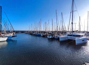 A marina with numerous sailboats docked in calm waters. - Family | Pool | Terrace | A/C | Golf (Golf del Sur)