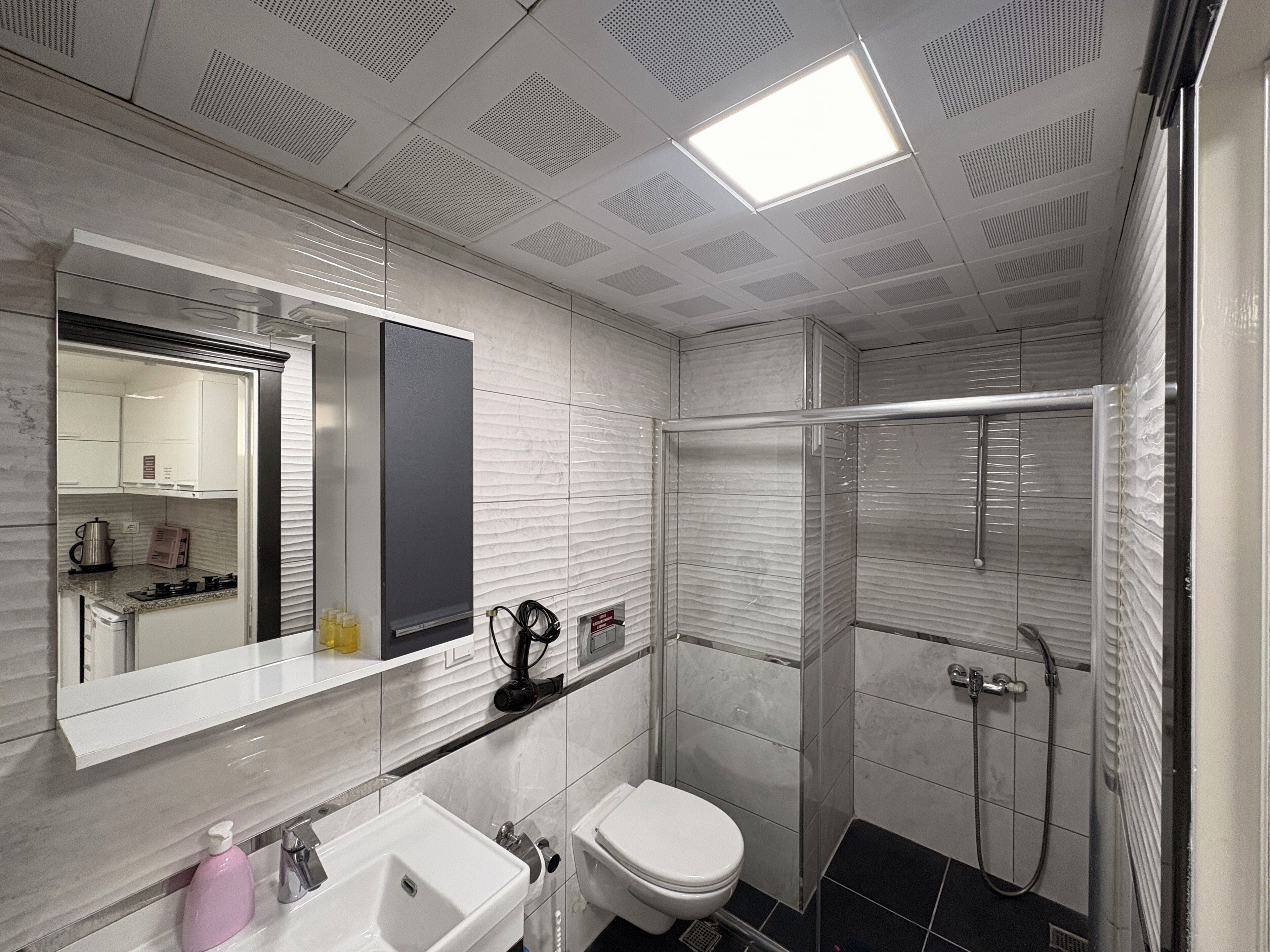 Classic Studio | Bathroom | Shower, hair dryer, slippers, towels