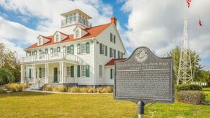 A historical building with a sign detailing an attack by U-123. - Romantic Island Stay | Free Parking & Breakfast | Pool Access | Pet Friendly (Jekyll Island)