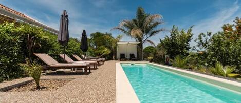 Seasonal outdoor pool, pool umbrellas, sun loungers