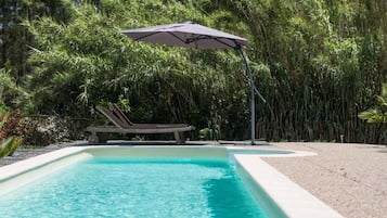 Seasonal outdoor pool, pool umbrellas, pool loungers