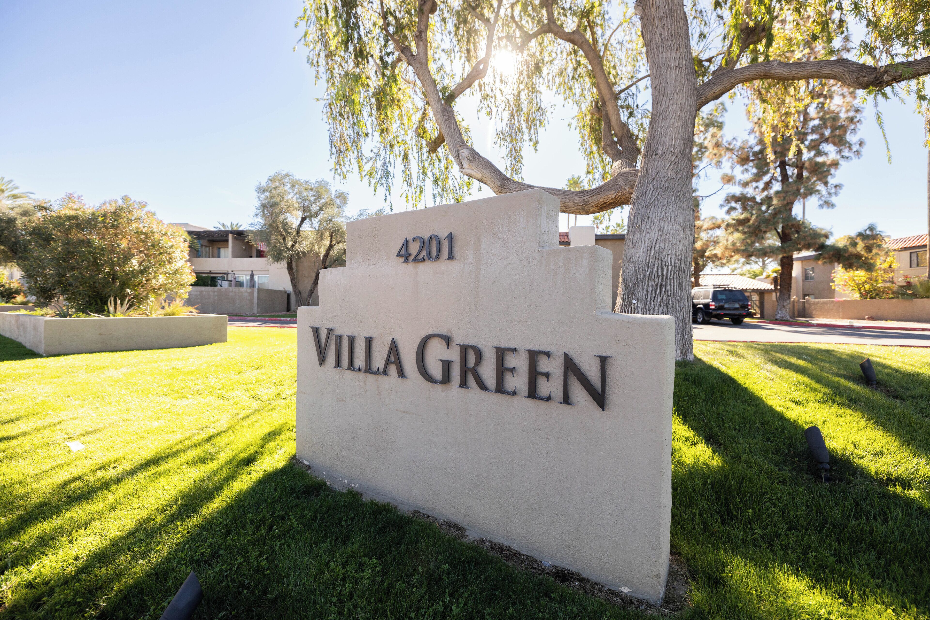 A sign for Villa Green with the address 4201.