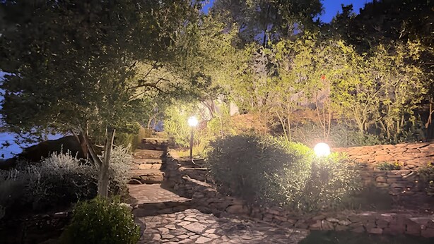 A stone pathway leading up a hill, surrounded by trees and shrubs. - casaVerdeMare charming detached villa Sardinia (Sardegna)