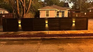 A residential property with a gated entrance, a paved driveway, and a house with a gabled roof. - Perfect 2-bedroom apartment with AC in nice Dallas neighborhood (Dallas)
