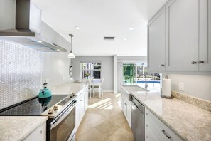 Fridge, microwave, oven, stovetop - Manatee Cove - Gorgeous Canal Front Home with Heated Pool and Deeded Beach Access! (Sanibel)