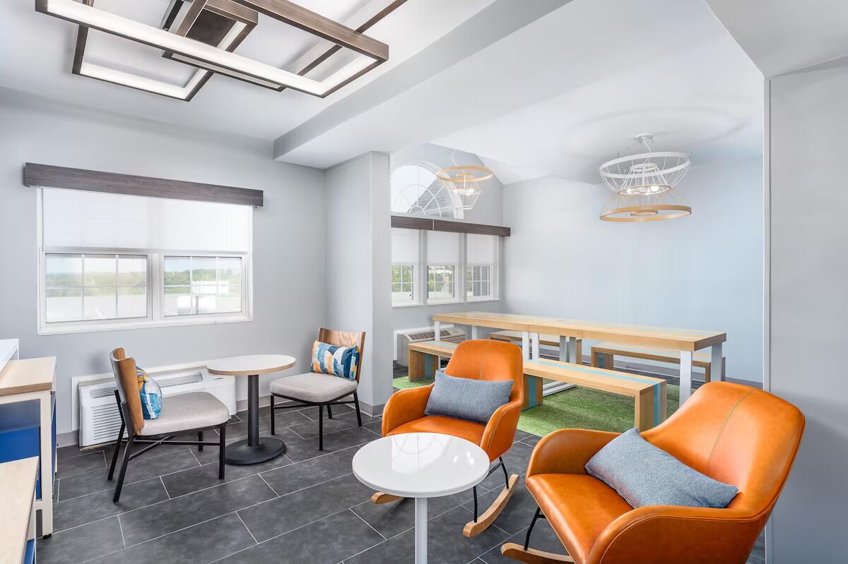 Unwind with coffee in this bright, modern communal lounge.