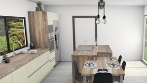 A modern kitchen with a wooden island, built-in appliances, and a dining area with a table and chairs. - Beautiful contemporary villa on one level, swimming pool, ideal for a stay in Reunion Island (Petite-Île)