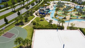 An aerial view of a park with a basketball court, a swimming pool, and a children's play area. - Last Minute Disney Getaway! Townhouse with Private Pool. Book Now! #149357 (Orlando)