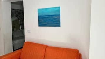 Comfort House, 1 Bedroom, Private Bathroom, City View | Living area | 40-inch Smart TV with digital channels, Netflix, streaming services