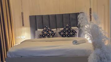 Desk, laptop workspace, blackout drapes, iron/ironing board