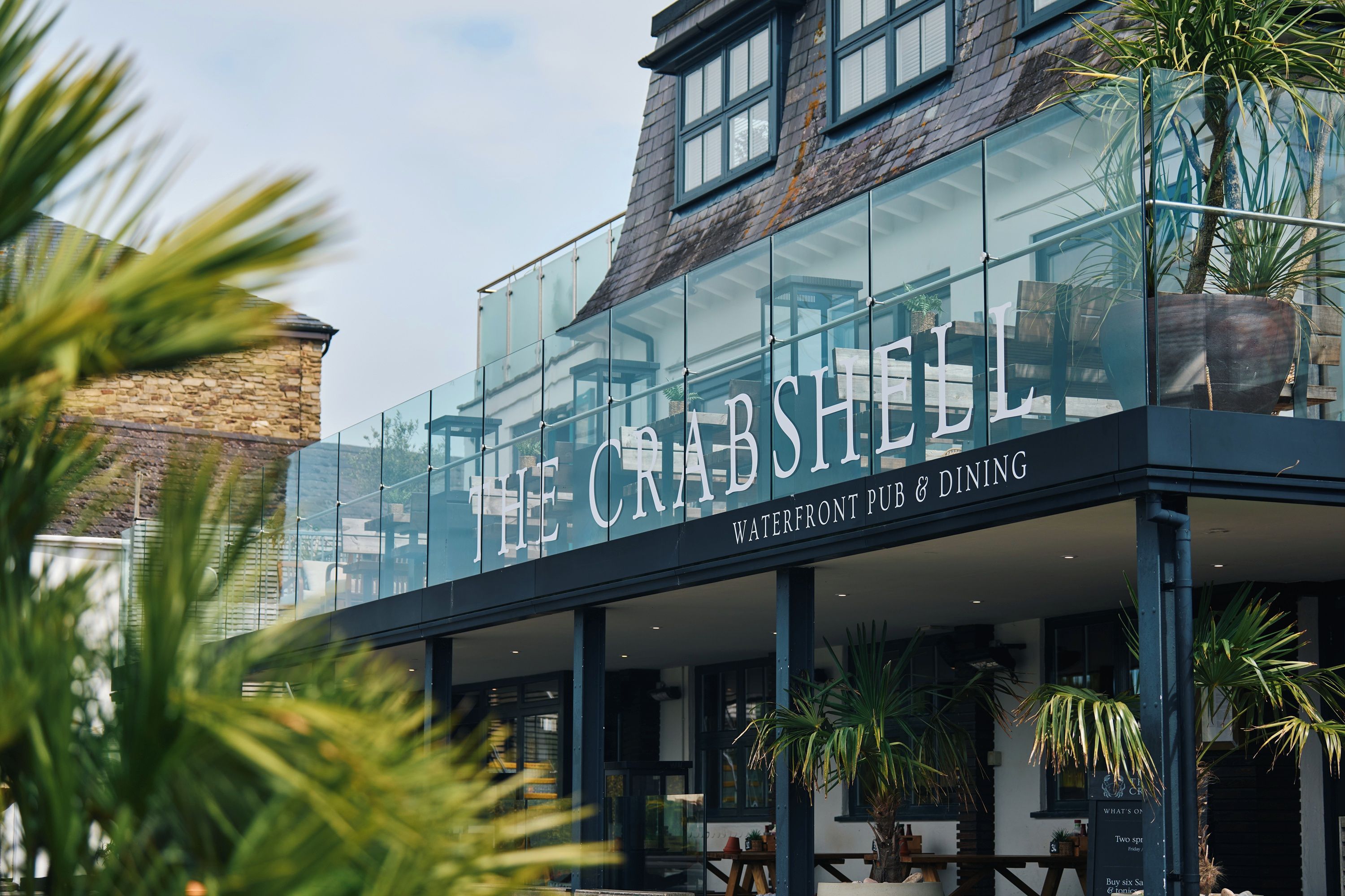 A building with a large glass facade and the name 'The Crabshell' prominently displayed.