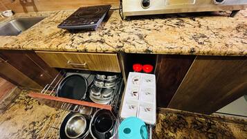 Fridge, stovetop, cookware/dishes/utensils, dining tables