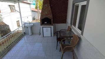 Apartment, City View, Garden Area | Outdoor dining