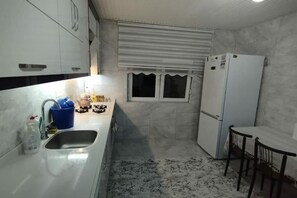 Apartamento, vista para a cidade, no jardim | Cozinha privada