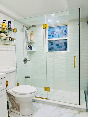 Shower, hair dryer, towels, soap