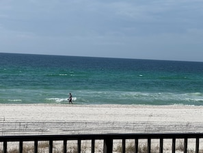 A beach with a person walking along the shore. - NEW LISTING! Beachfront 2 BR, 2 BA.Total remodel Jan. 2026. AquaVista 403W (Panama City Beach)