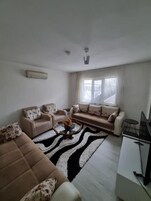 Apartamento, patio, vistas al patio | Zona de estar