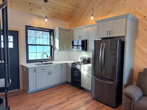 Fridge, microwave, stovetop, coffee/tea maker