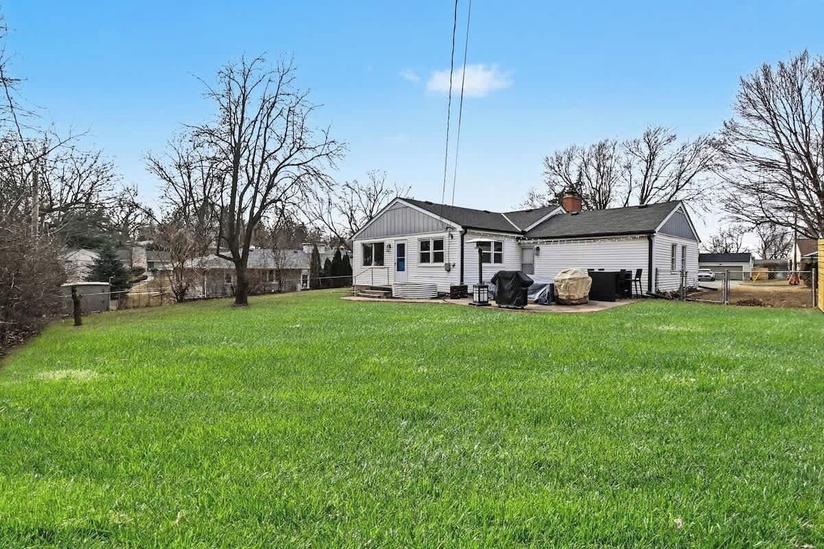 A single-story house with a front yard and a garage.