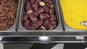 A buffet with various food items including meats, vegetables, and breads. - Pousada Doce Mar: Comfort and tranquility just steps from the beach. (Maragogi)