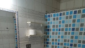 A bathroom with a sink, toilet, and shower curtain. - House in el quisco (El Quisco)