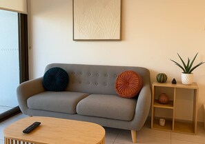 Apartamento, vista para a cidade | Área de estar