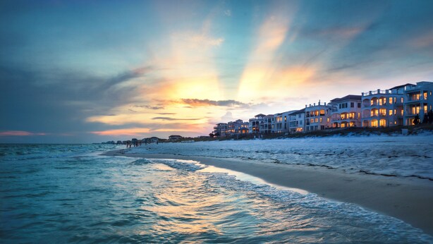 A beachfront property with multiple buildings, a sandy beach, and a view of the ocean. - Only 3 minutes walk to beach - Spacious Destin Home, Newly-renovated (Destin)