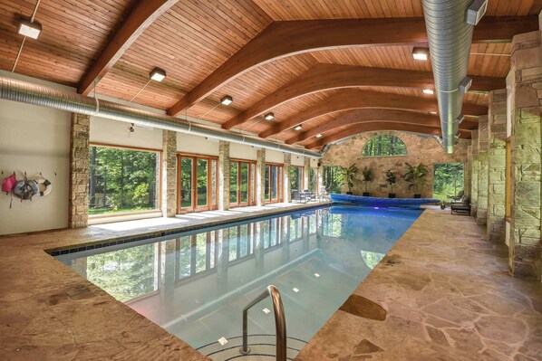A large indoor swimming pool with stone walls and wooden beams. - Grand River Estate IndoorPool/Swim Pond/25 Acres (Thompson)