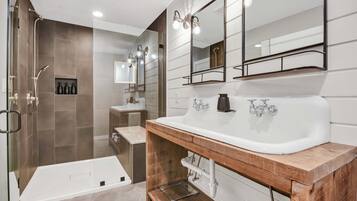 Shower, hair dryer, towels, shampoo
