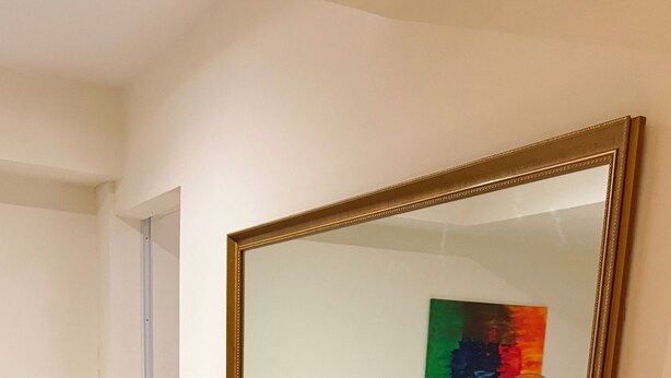 A dining area with a table, four chairs, and a large mirror. - Azure Urban Resort 1BR-2BR Boracay (Parañaque)