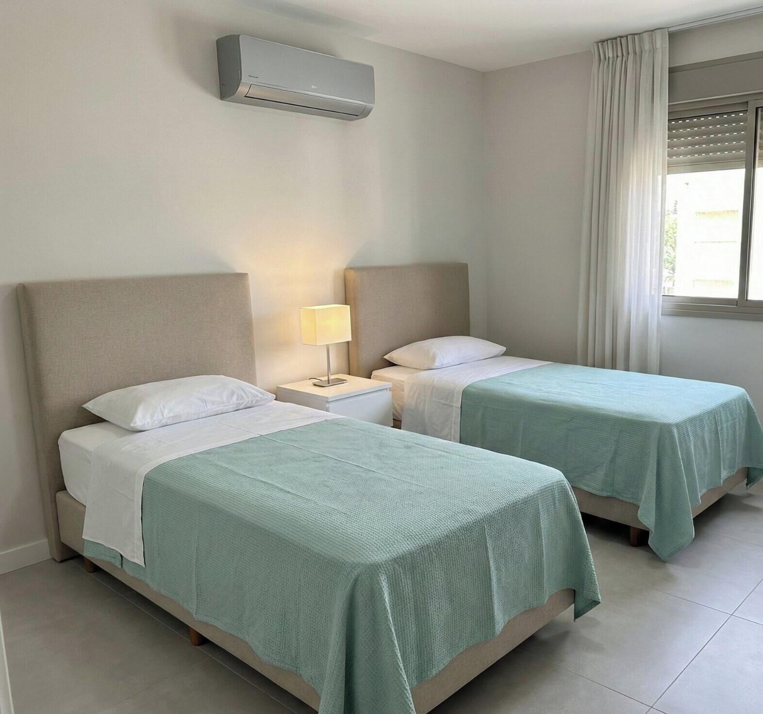 Luxury Condo, Partial Sea View | In-room safe, desk, laptop workspace, blackout drapes