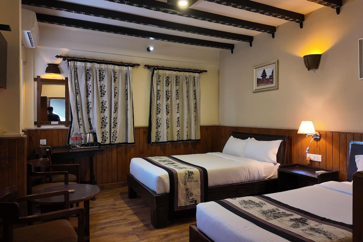 Family Room, Garden View | In-room safe, soundproofing, iron/ironing board, free WiFi