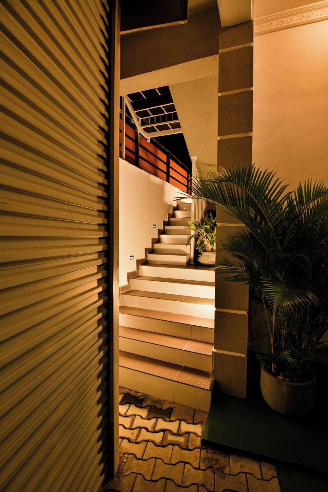 A staircase with a modern design, leading to an upper level.