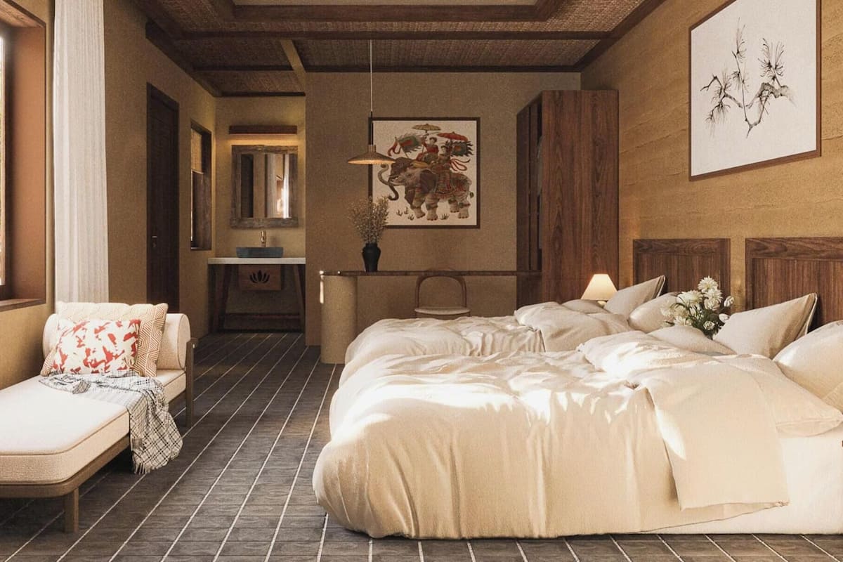 Una camera da letto con un letto grande, un comodino, una sedia, un tavolino con una lampada, uno specchio e una finestra con tende.
