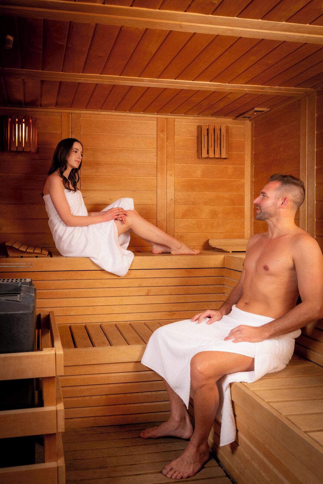 A sauna with wooden benches and a bench for a child.