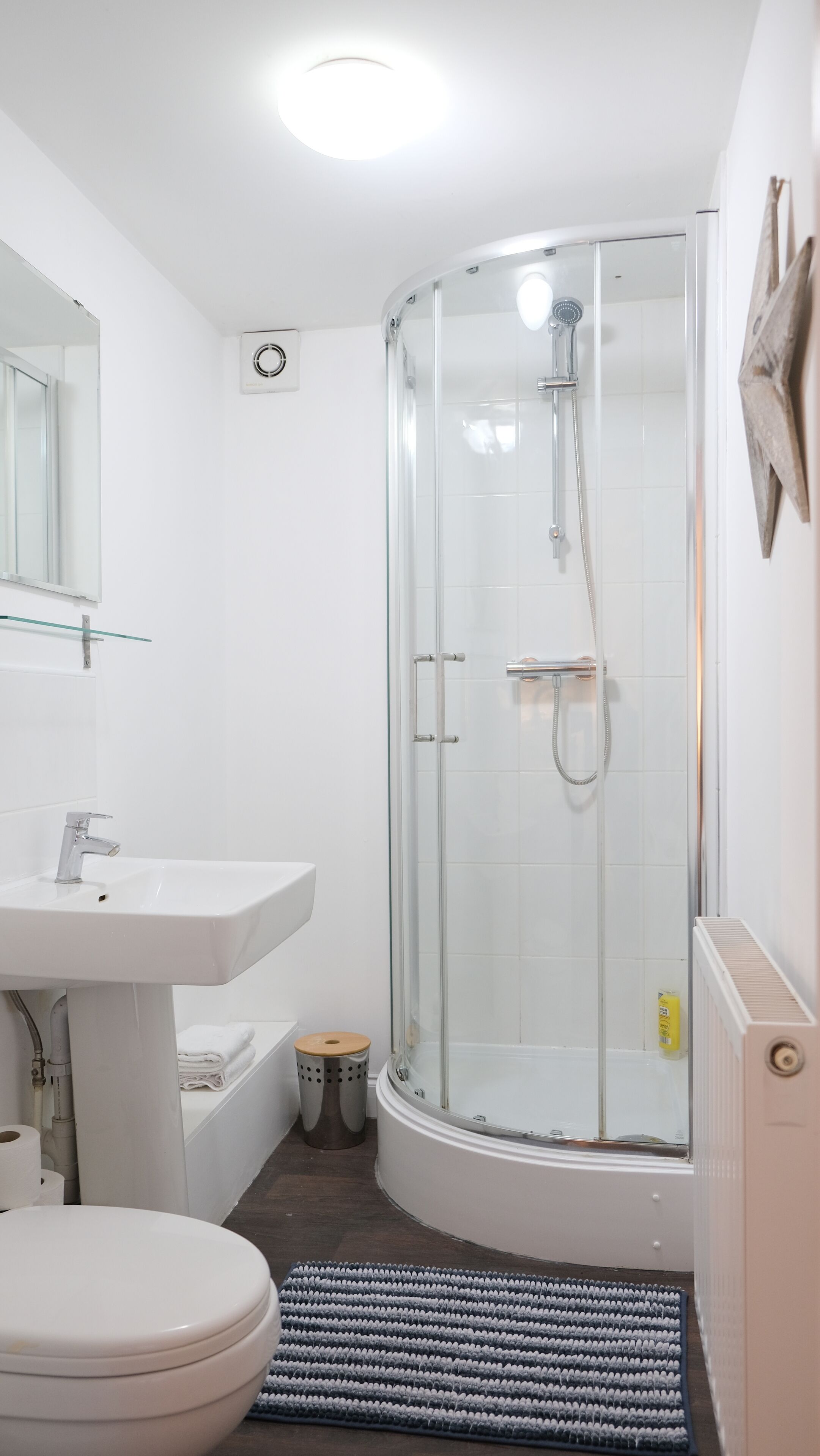 Shower, hair dryer, towels, shampoo